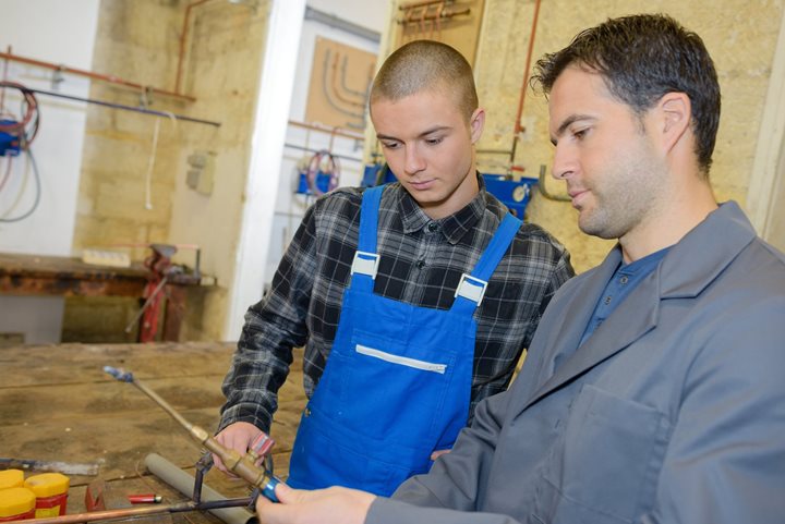 Two men training at a jobsite